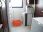 utility room housing the washing machine, dryer, fridge/feezer and deep freezer