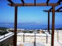 The two upstairs bedrooms share the spacious, pergola-covered terrace...